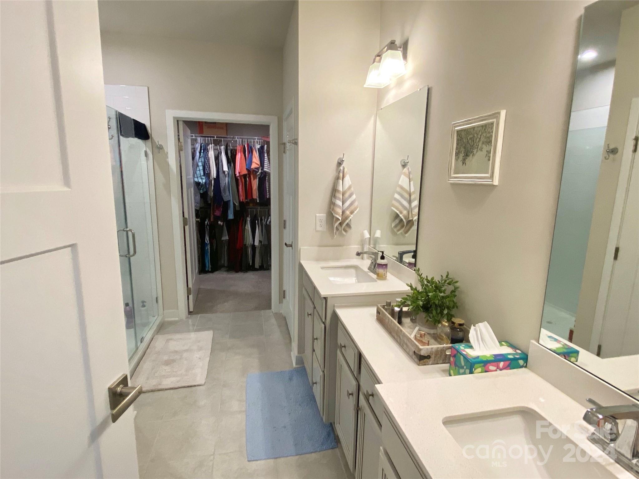 765 Hazel Way Denver, NC 28037 - Photo 15 of 35 a bathroom with a sink vanity granite tub shower and a mirror