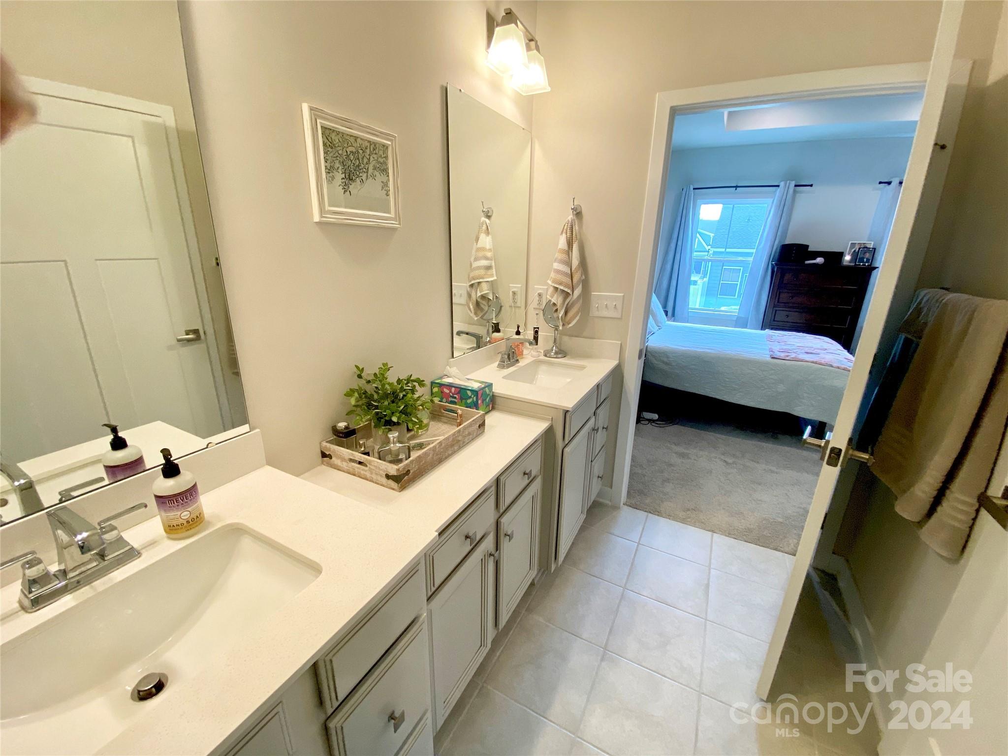 765 Hazel Way Denver, NC 28037 - Photo 16 of 35 a spacious bathroom with a tub sink and mirror