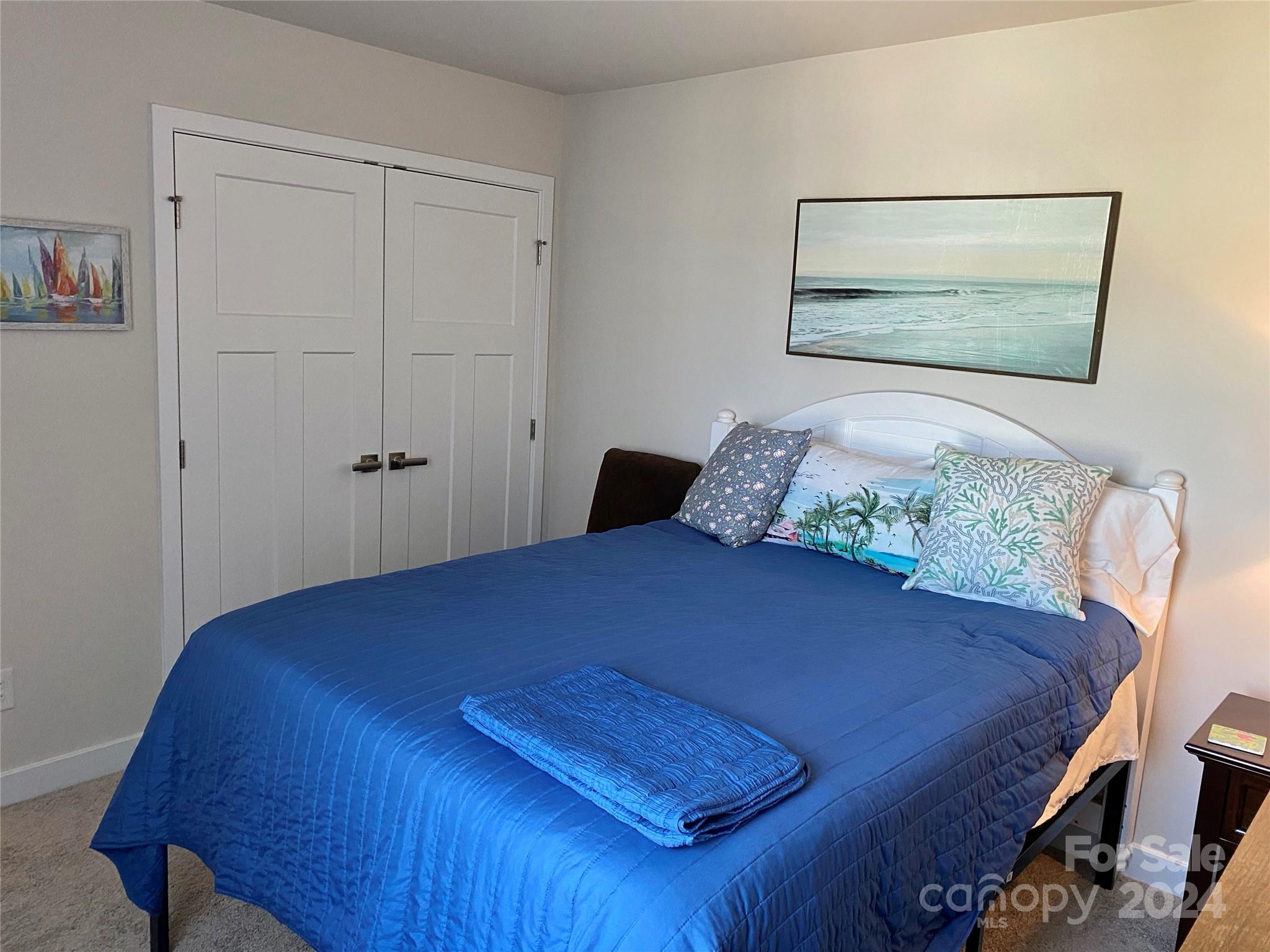 765 Hazel Way Denver, NC 28037 - Photo 17 of 35 a bedroom with a bed and window