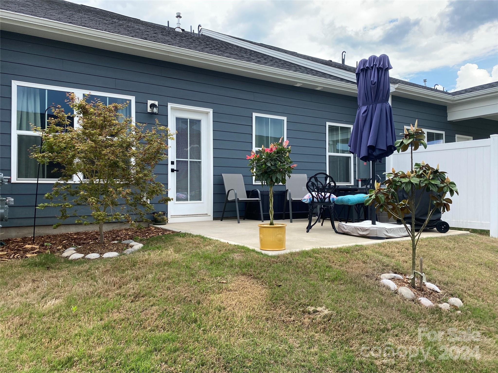 765 Hazel Way Denver, NC 28037 - Photo 18 of 35 a view of a house with backyard and sitting area