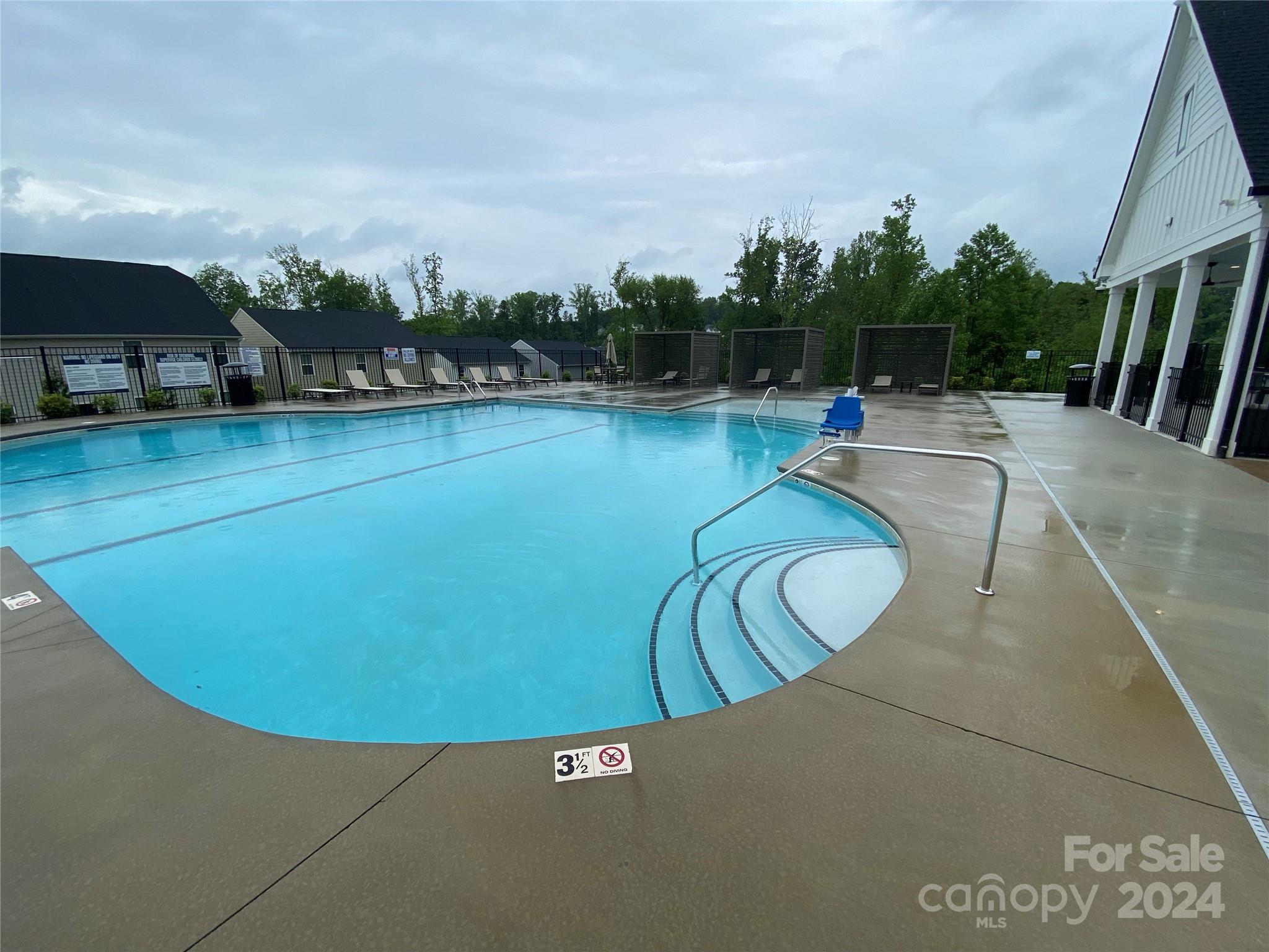 765 Hazel Way Denver, NC 28037 - Photo 19 of 35 a view of a swimming pool with a yard and a sitting area