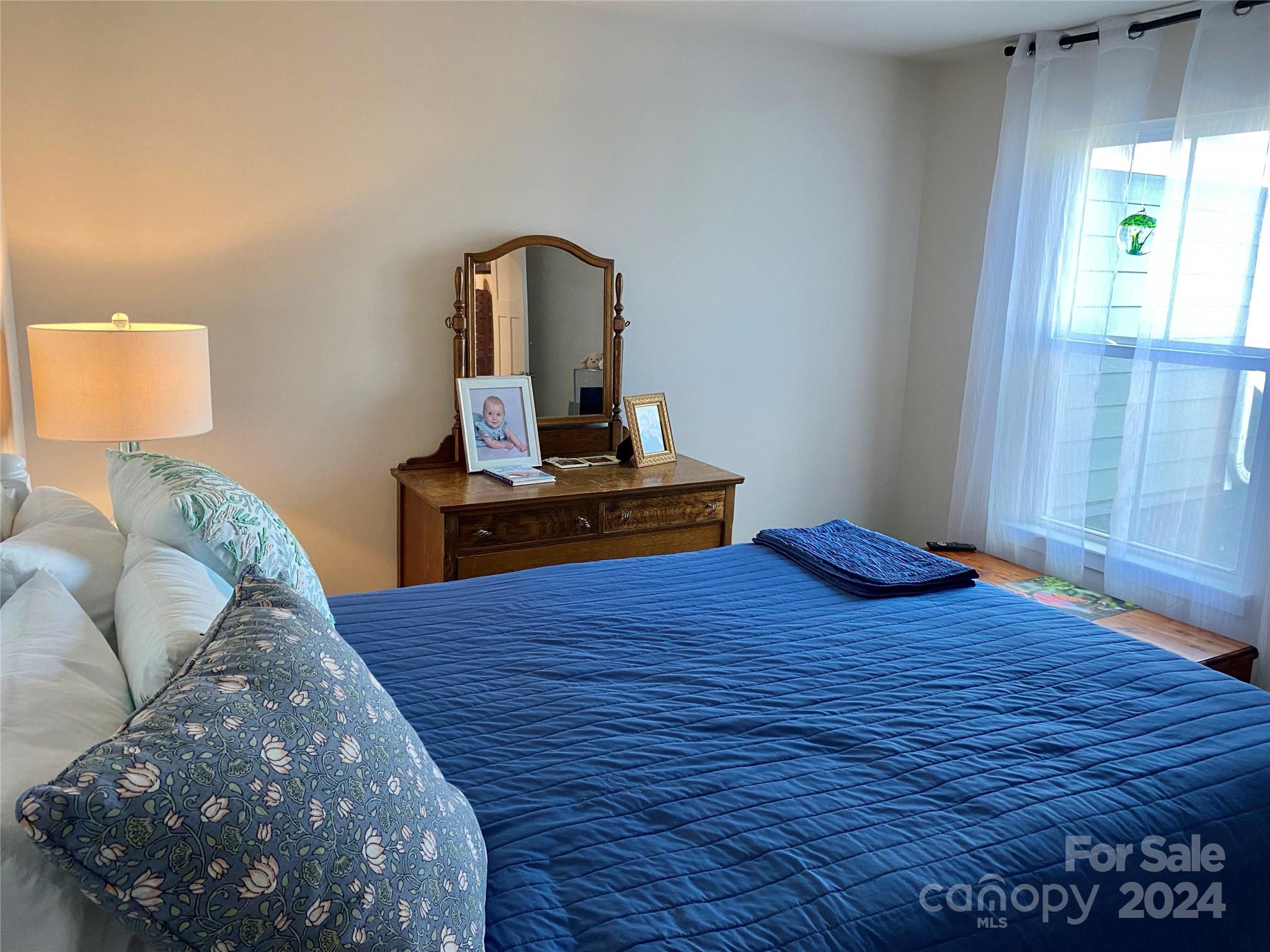 765 Hazel Way Denver, NC 28037 - Photo 20 of 35 a bed room with a bed and a window