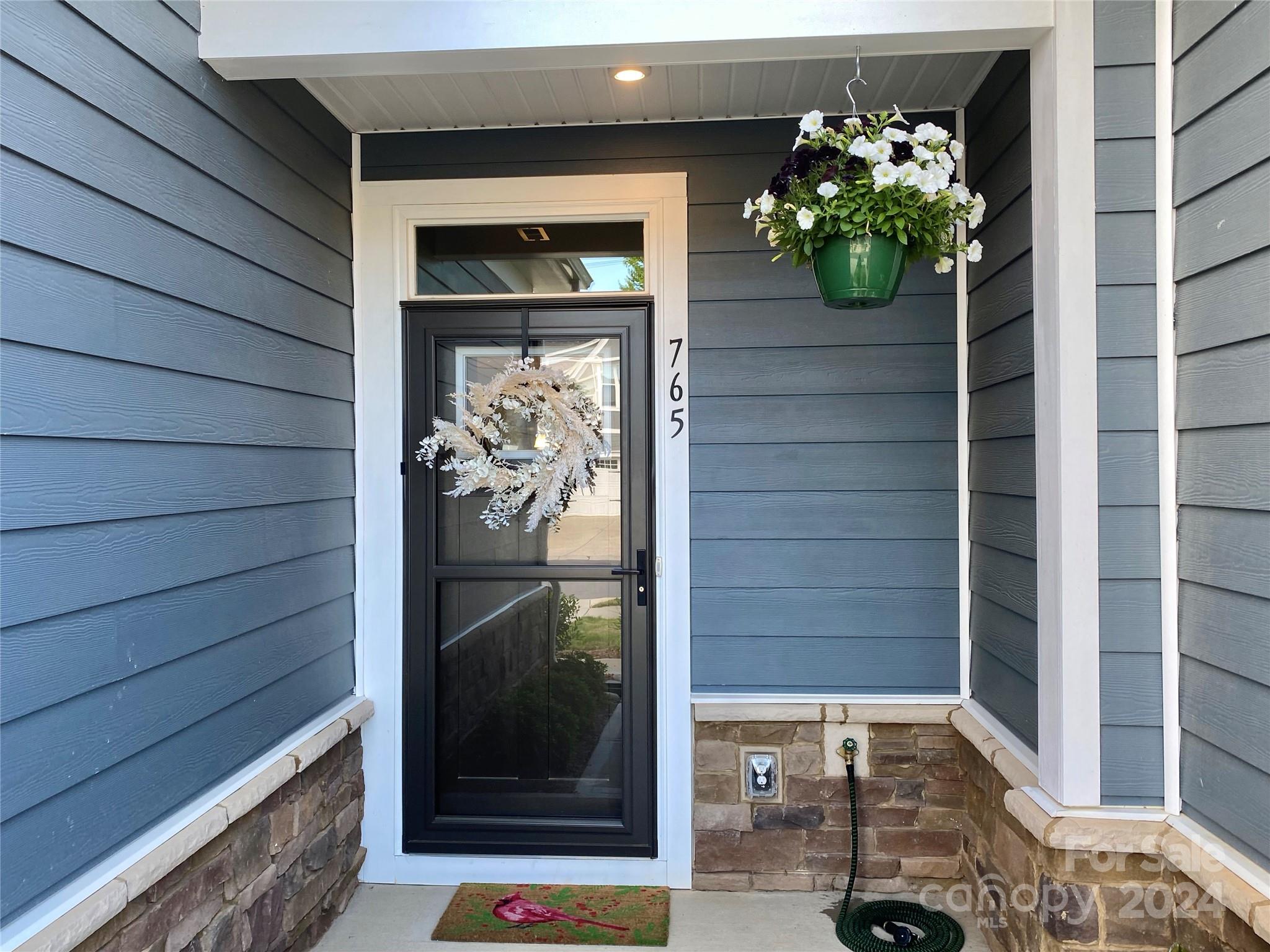 765 Hazel Way Denver, NC 28037 - Photo 2 of 35 a front view of a house with a porch