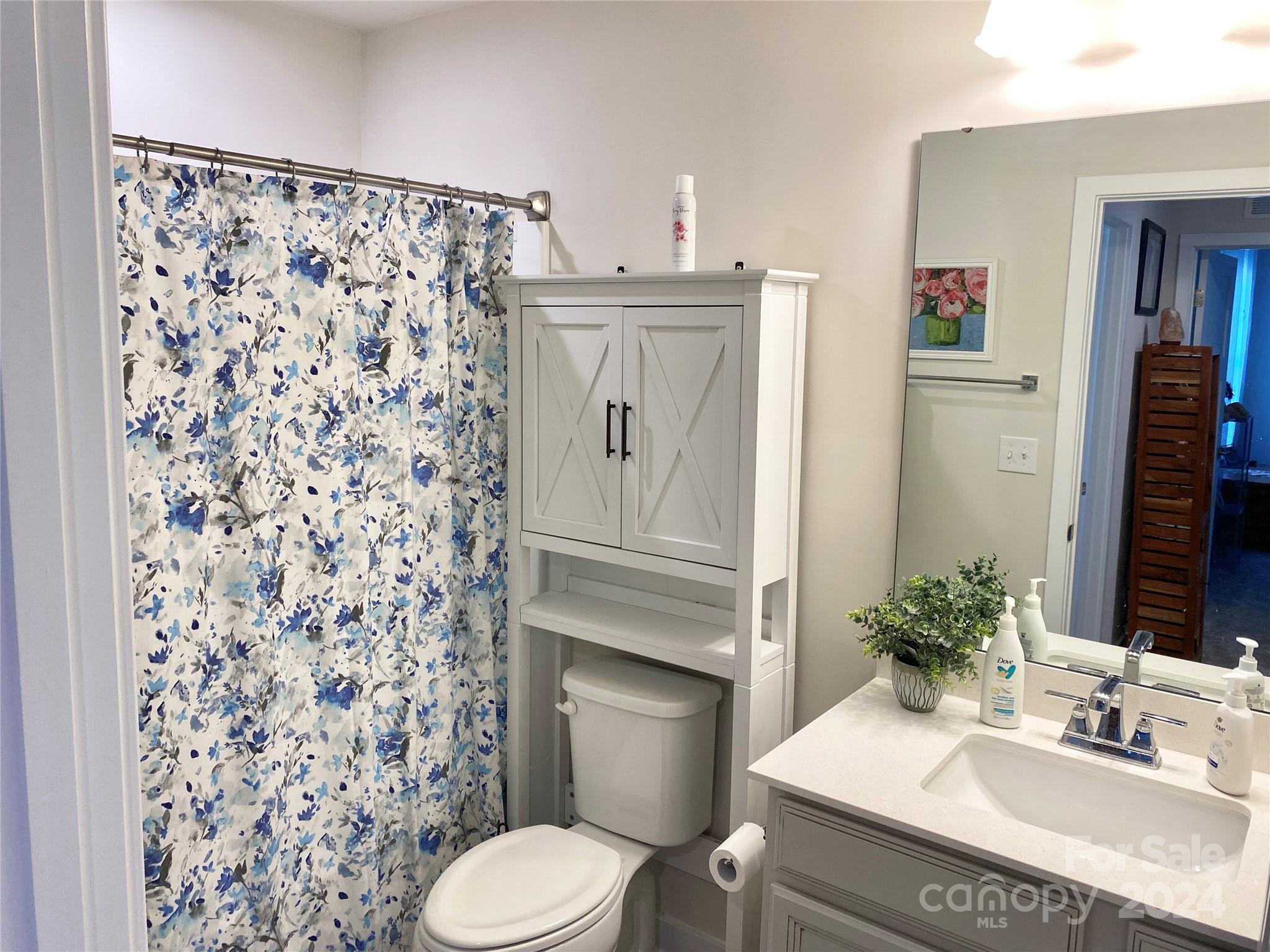 765 Hazel Way Denver, NC 28037 - Photo 21 of 35 a bathroom with a sink toilet and shower
