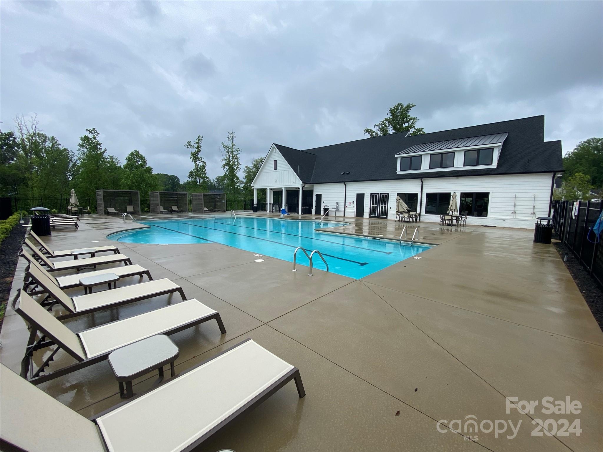 765 Hazel Way Denver, NC 28037 - Photo 24 of 35 a front view of a house with garden