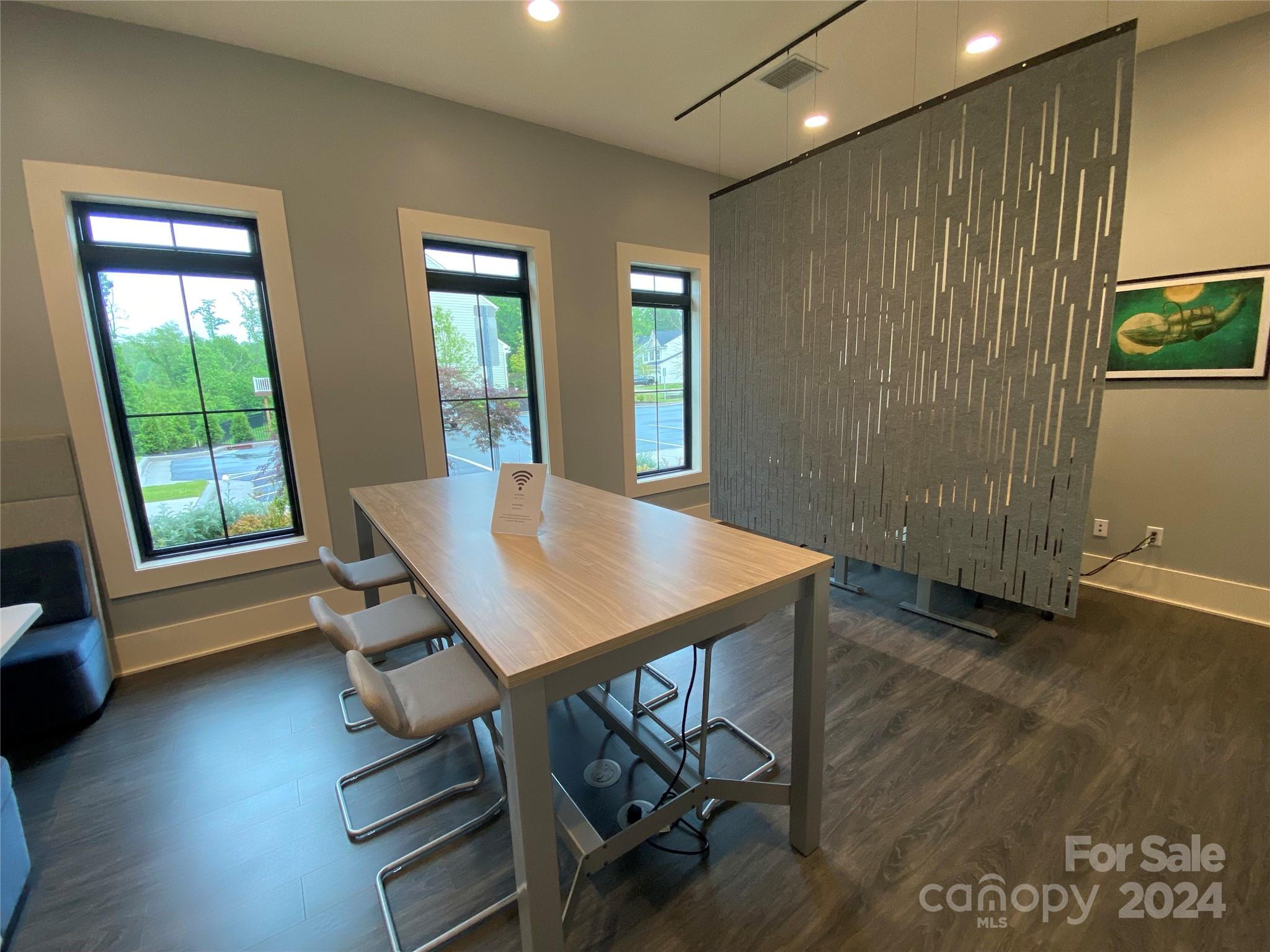 765 Hazel Way Denver, NC 28037 - Photo 27 of 35 a view of a dining room with furniture and wooden floor