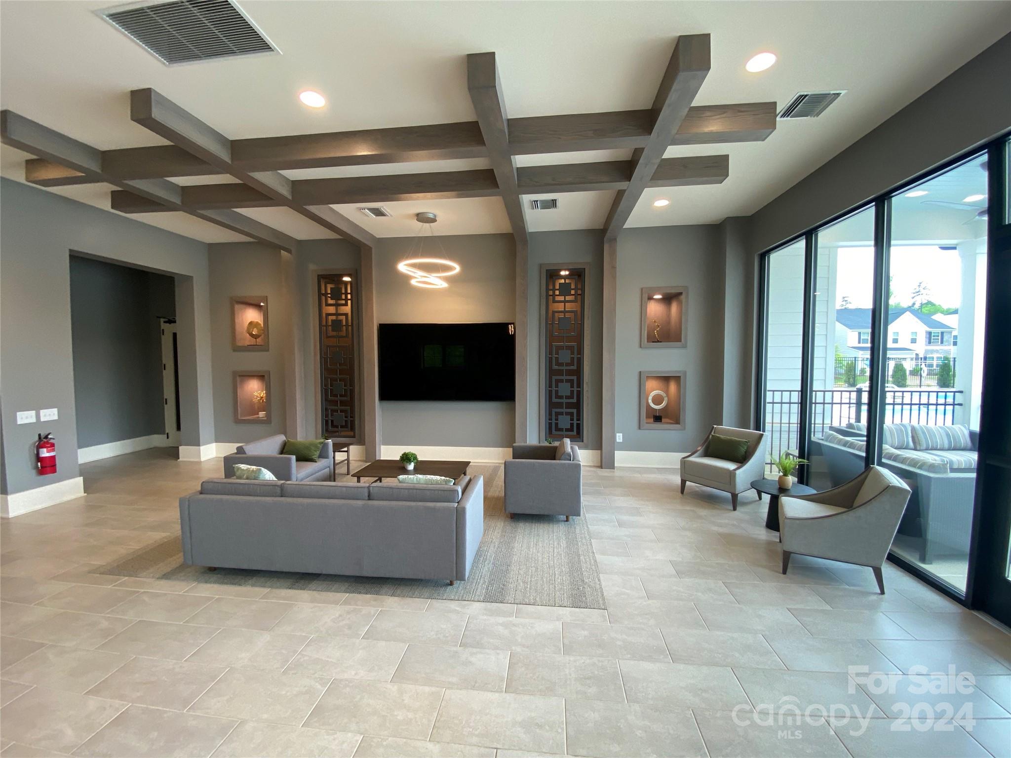 765 Hazel Way Denver, NC 28037 - Photo 34 of 35 a living room with furniture and a flat screen tv