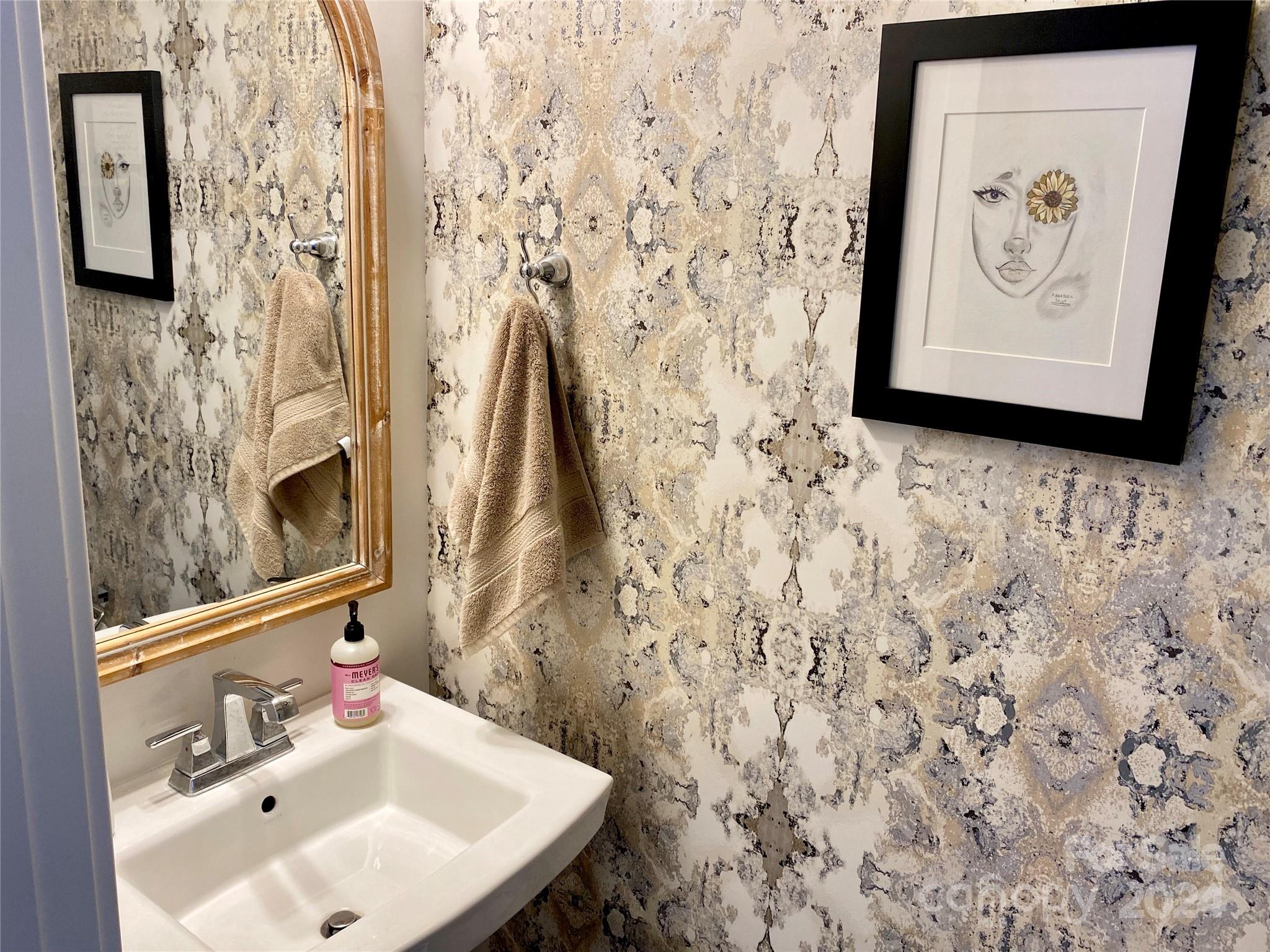 765 Hazel Way Denver, NC 28037 - Photo 10 of 35 a bathroom with a sink and a mirror