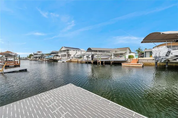 a view of an empty room and wooden floor