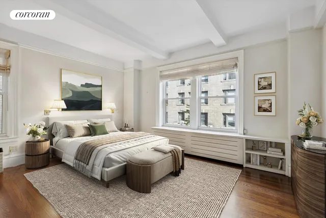 a bedroom with a bed wooden floor and window