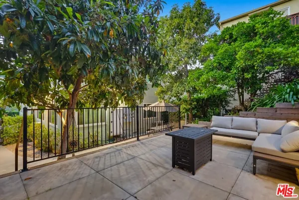 a view of a patio with couches and table