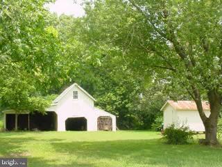 6305 Quantico Road Quantico, MD 21856 - Photo 2 of 5 a view of house with backyard