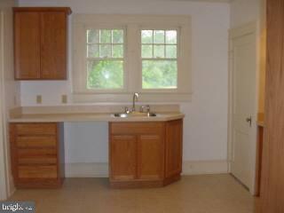 6305 Quantico Road Quantico, MD 21856 - Photo 3 of 5 a bathroom with a sink and a vanity