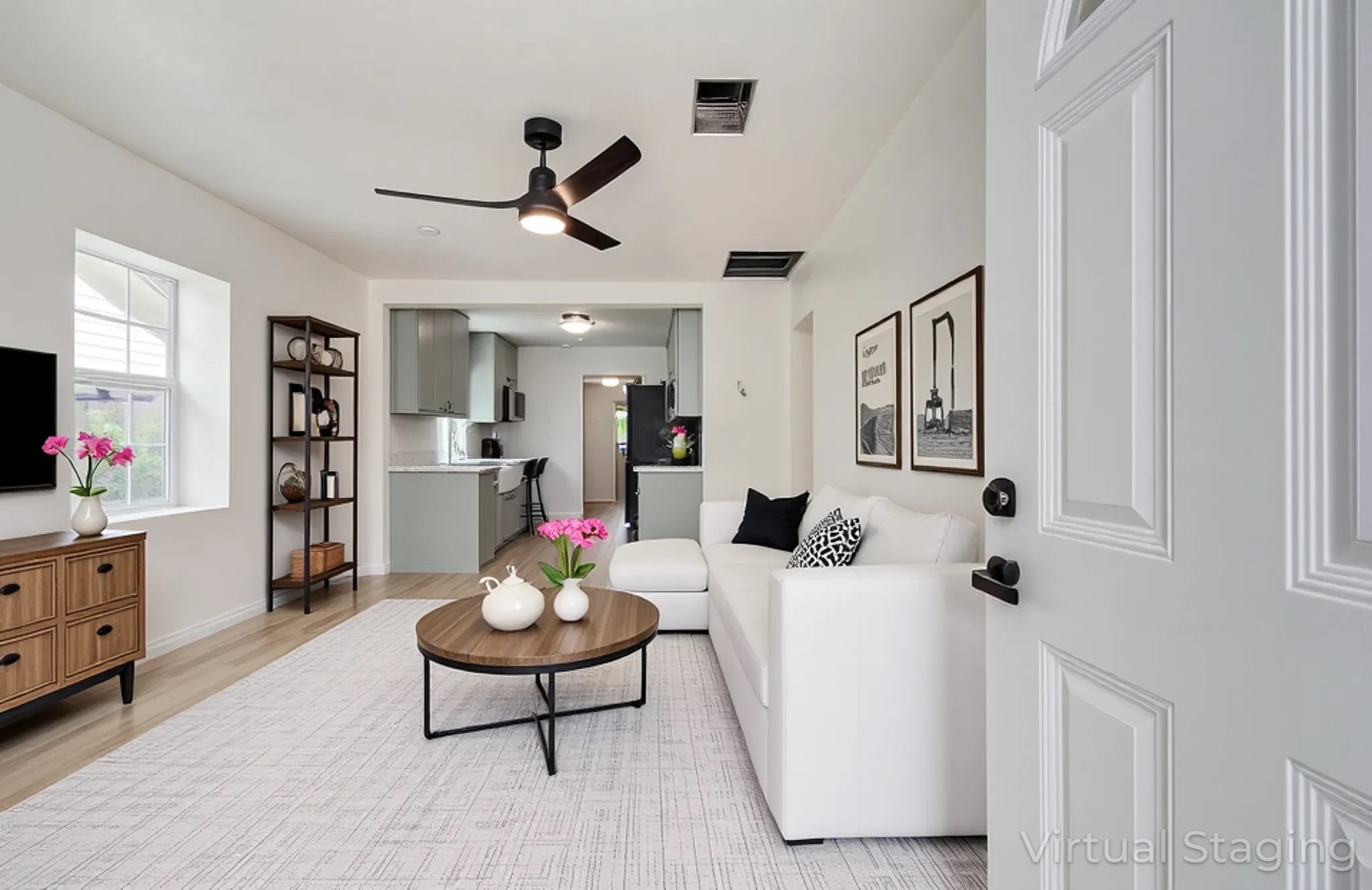 a living room with furniture and a chandelier