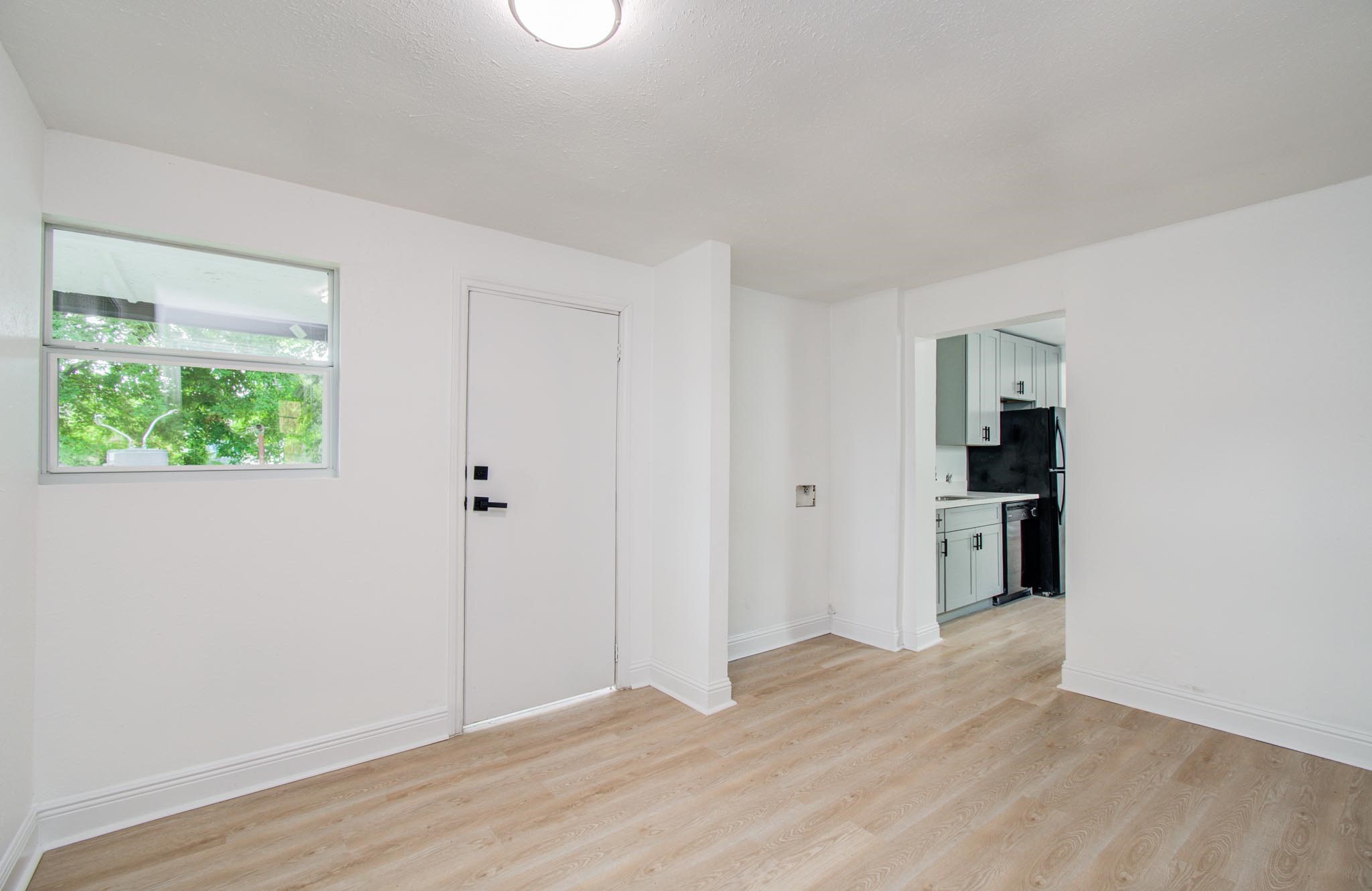 10309 Wiggins Street Houston, TX 77029 - Photo 15 of 32 a view of a kitchen with wooden floor and a window