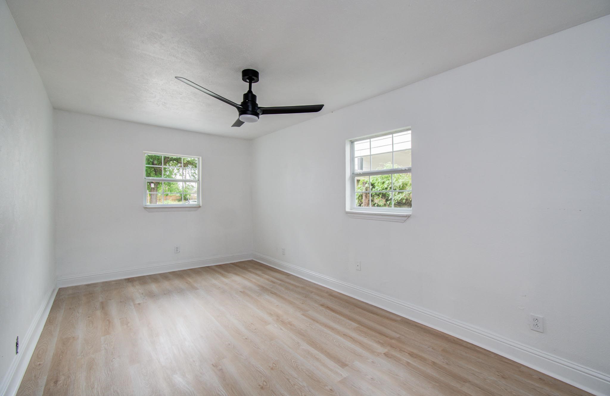 10309 Wiggins Street Houston, TX 77029 - Photo 24 of 32 wooden floor in an empty room with a window