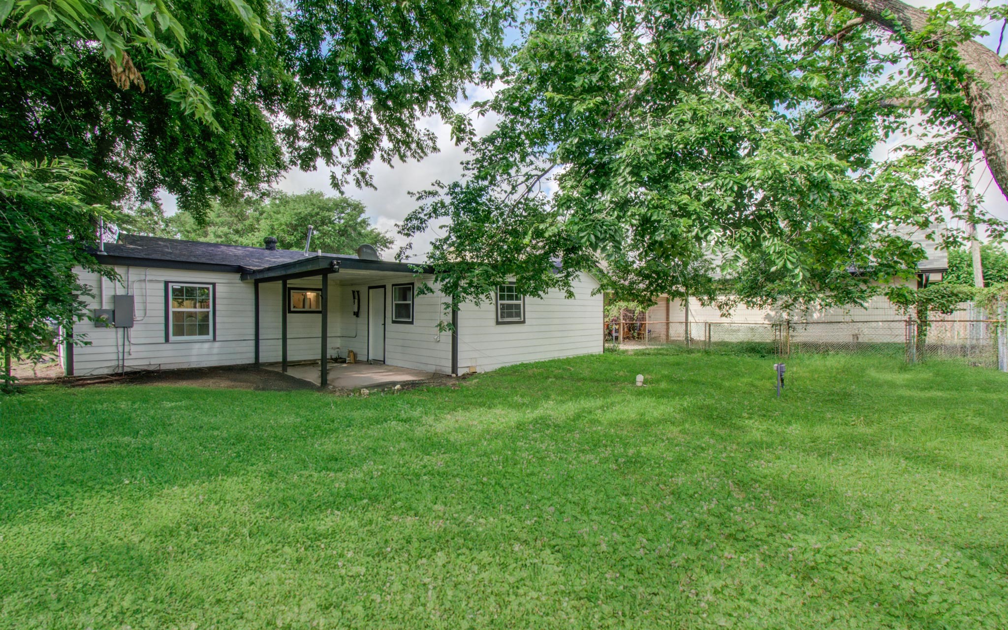 10309 Wiggins Street Houston, TX 77029 - Photo 26 of 32 a view of a house with a backyard