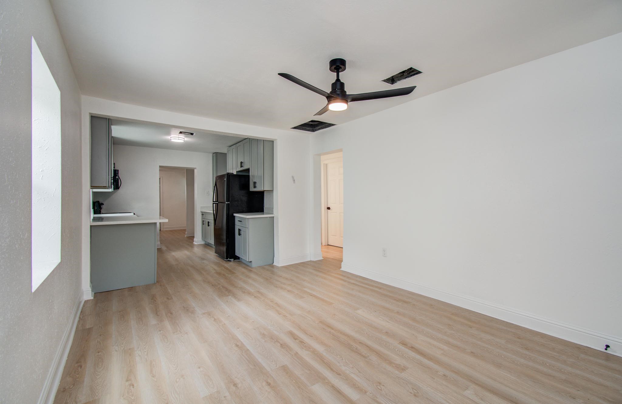 10309 Wiggins Street Houston, TX 77029 - Photo 8 of 32 a view of a kitchen with a sink and a refrigerator