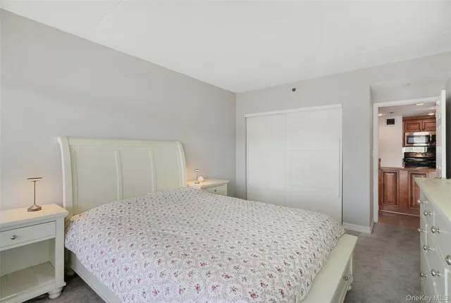 a bedroom with a bed and a view of bathroom