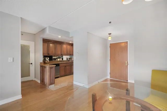 a kitchen with stainless steel appliances a refrigerator and a stove top oven