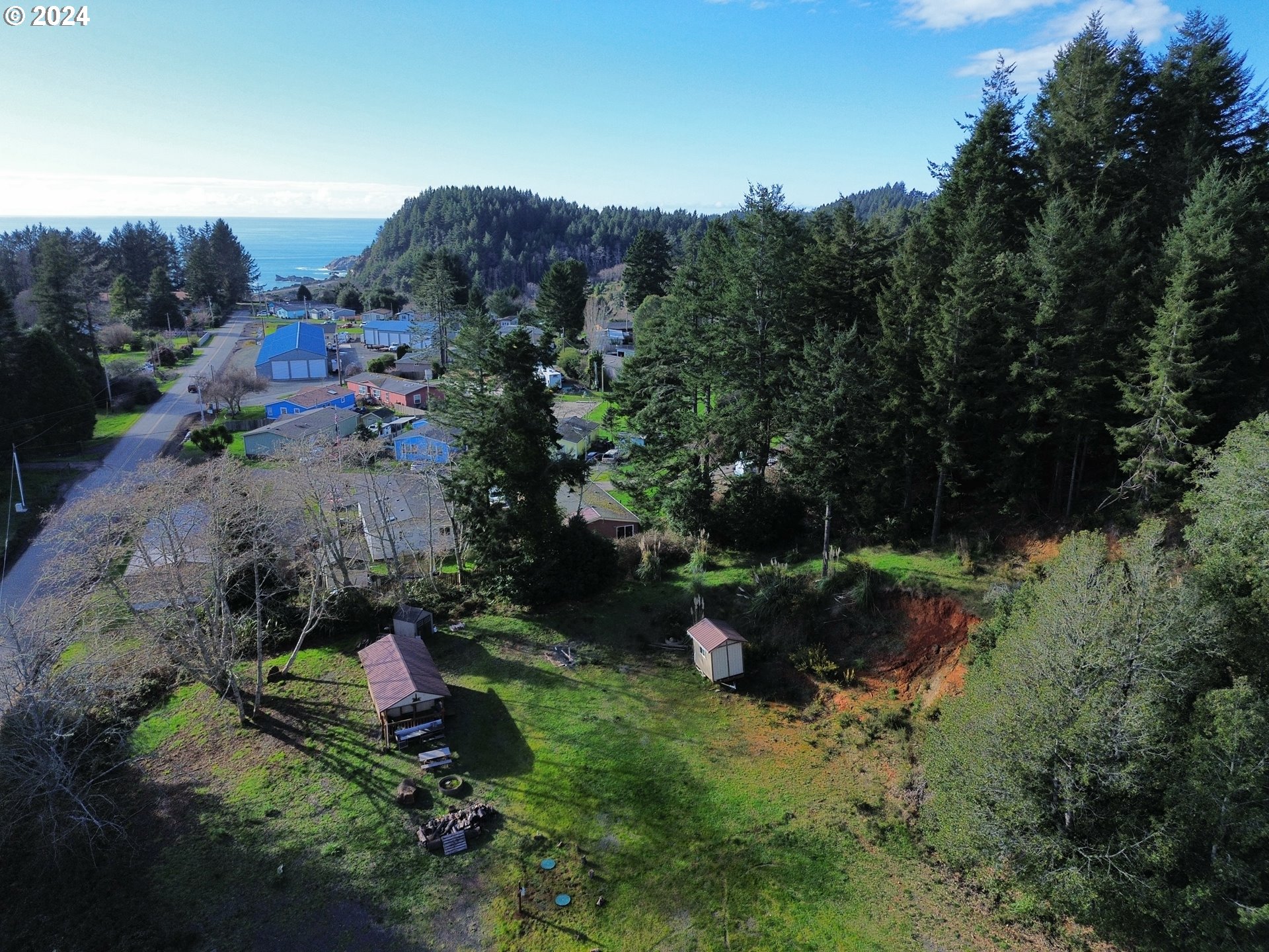 Rainbow Rock Road Brookings, OR 97415 - Photo 3 of 11 a view of a house with a yard