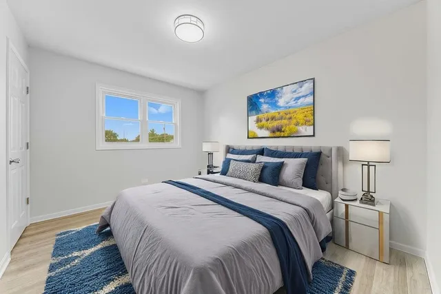 a bedroom with bed and lamps