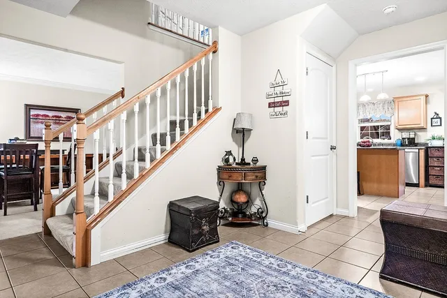 a view of entryway and hall with dining room