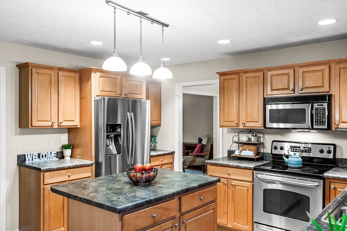 2985 Bear Claw Street Normal, IL 61761 - Photo 14 of 51 a kitchen with a stove a sink and a refrigerator
