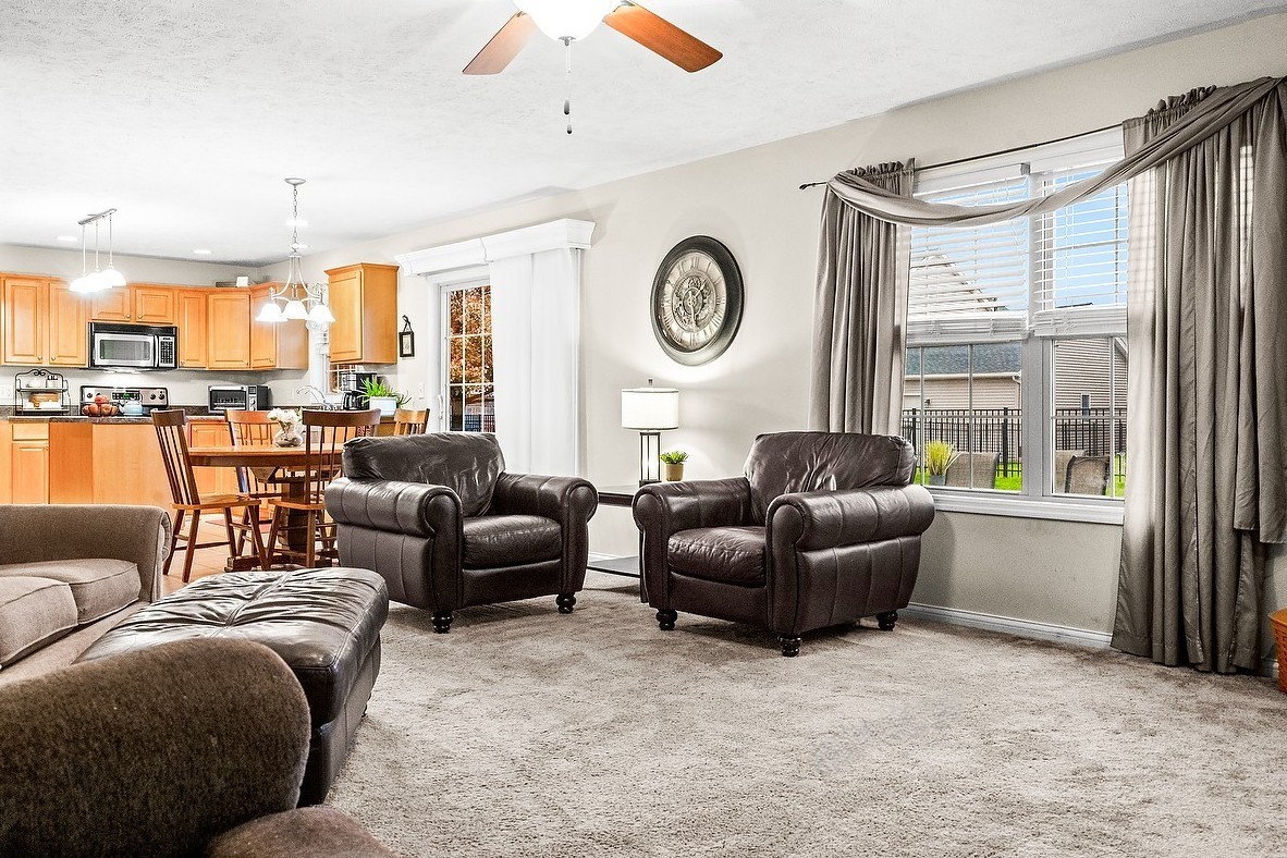 2985 Bear Claw Street Normal, IL 61761 - Photo 23 of 51 a living room with furniture and a large window