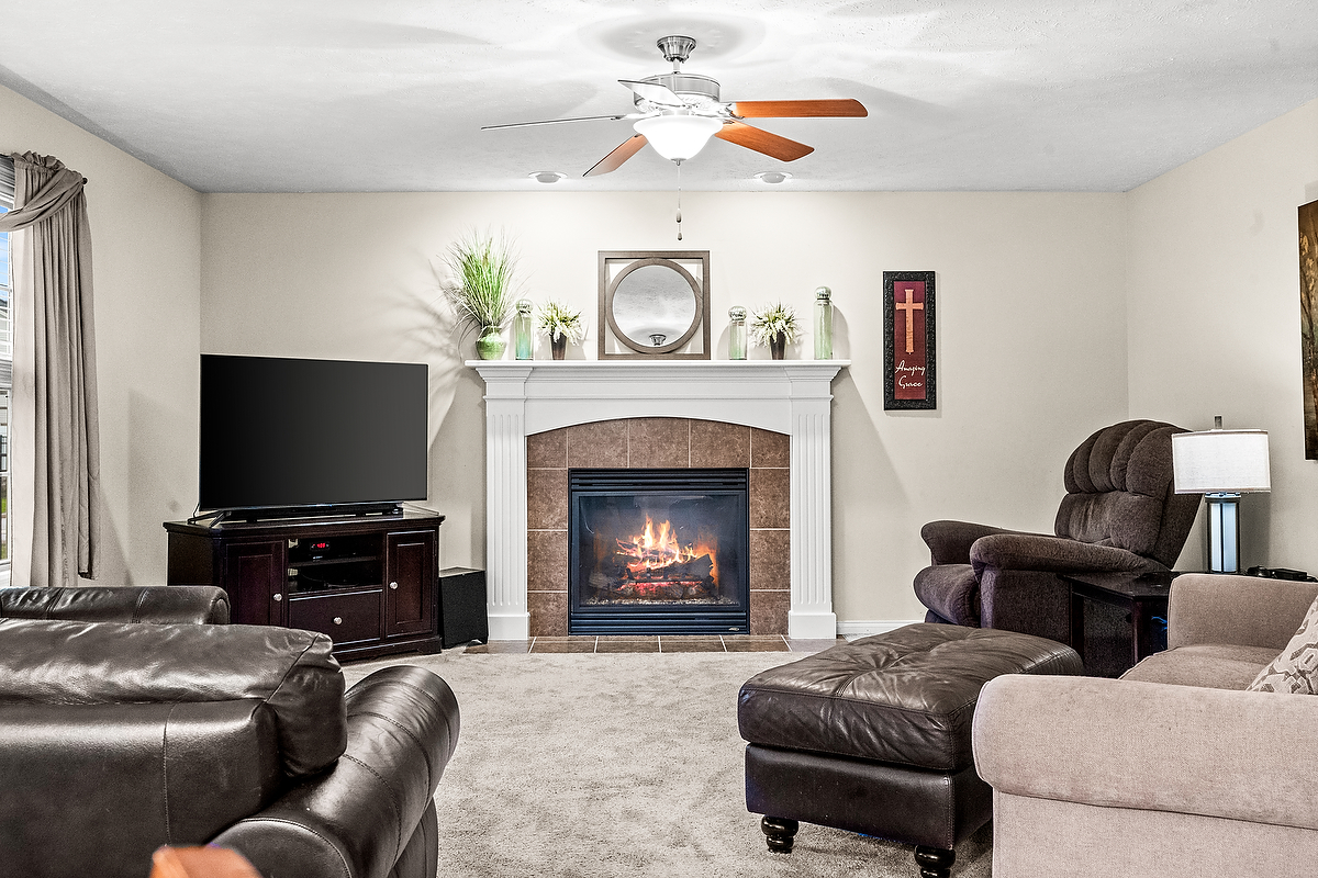 2985 Bear Claw Street Normal, IL 61761 - Photo 24 of 51 a living room with furniture and a fireplace