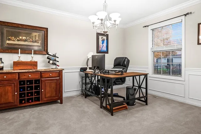 a dining room with furniture and window