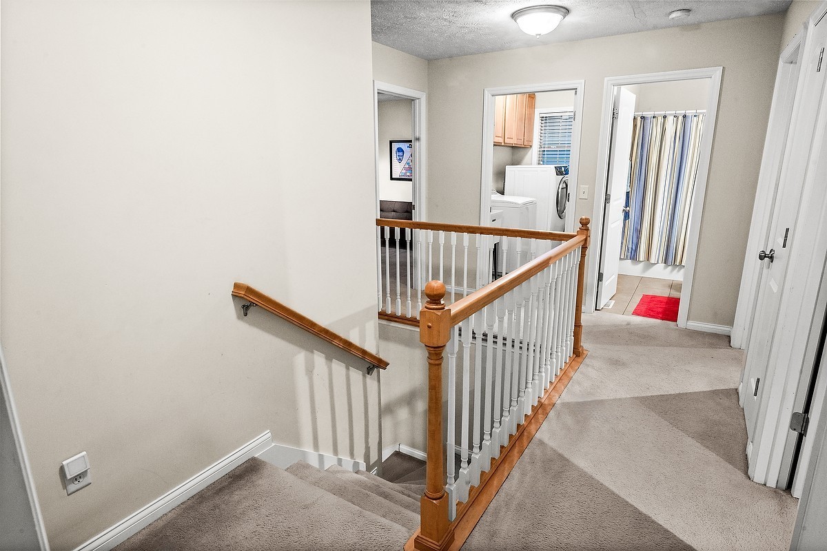 2985 Bear Claw Street Normal, IL 61761 - Photo 34 of 51 a view of staircase with railing and white walls