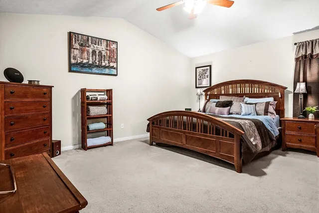 a bedroom with furniture and a window