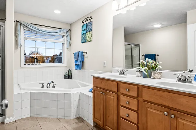 a bathroom with a shower and a sink