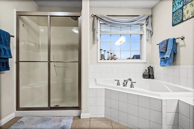 a bathroom with a sink double vanity and a bathtub