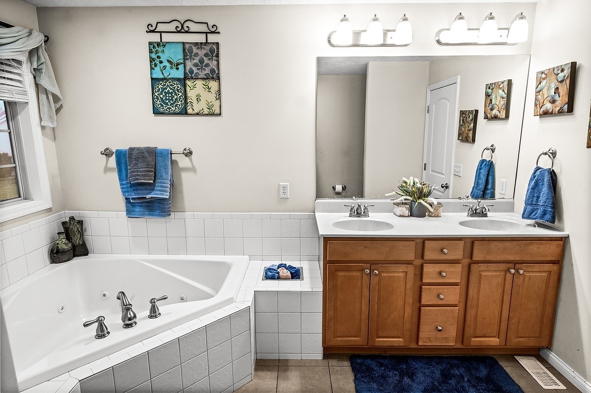 2985 Bear Claw Street Normal, IL 61761 - Photo 41 of 51 a bathroom with a sink double vanity and a bathtub