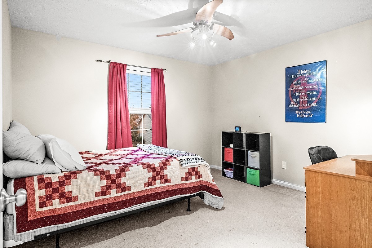 2985 Bear Claw Street Normal, IL 61761 - Photo 43 of 51 a bedroom with a bed and a chandelier