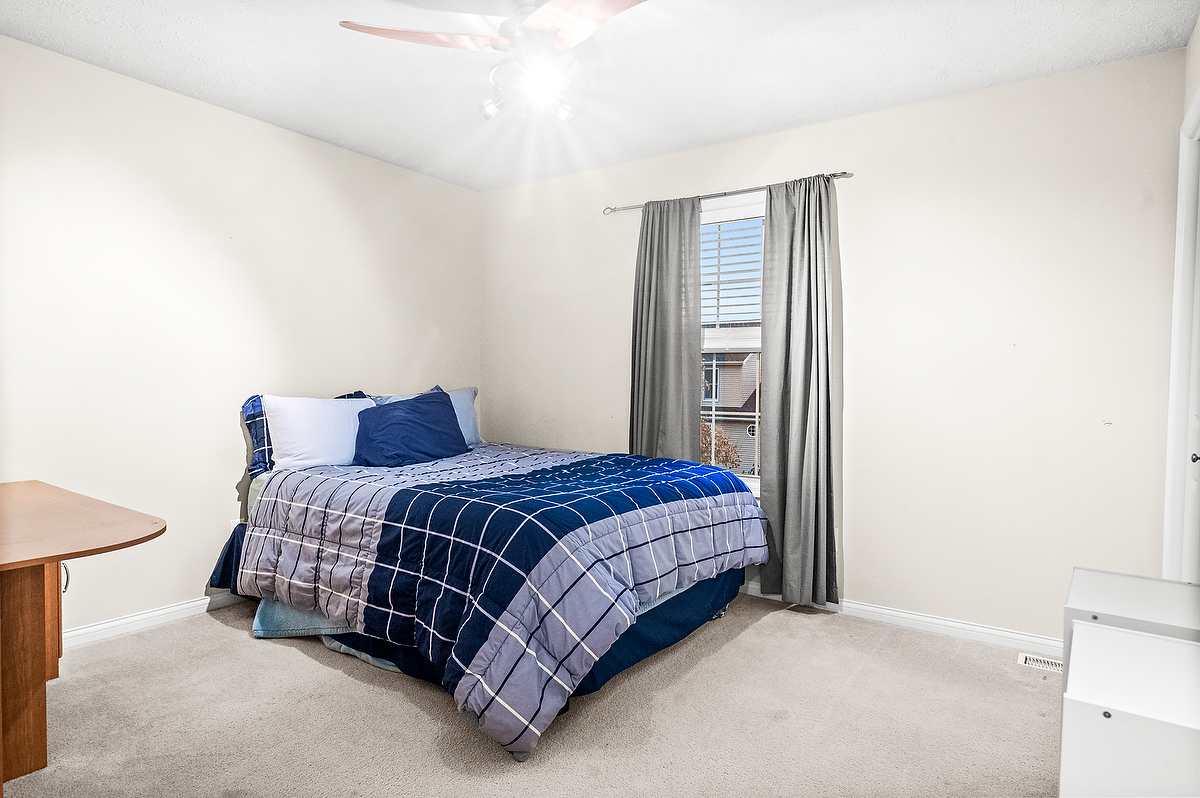 2985 Bear Claw Street Normal, IL 61761 - Photo 45 of 51 a spacious bedroom with a bed and a lamp