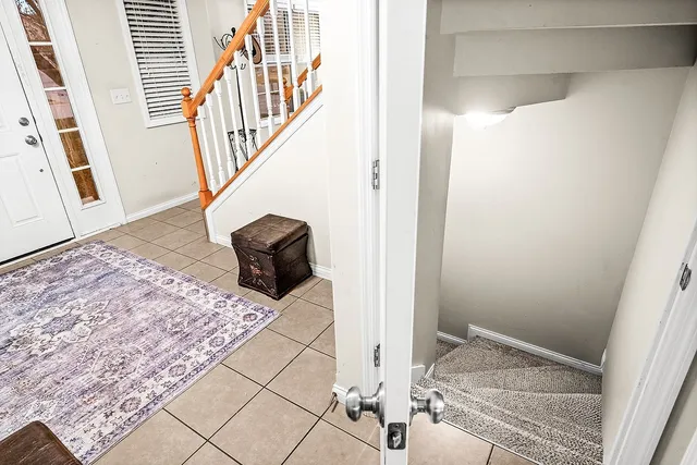 a bedroom with bed and a flat screen tv