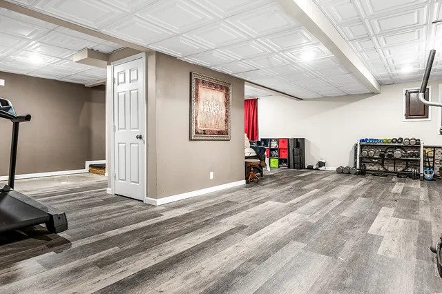 a bedroom with bed and a couch