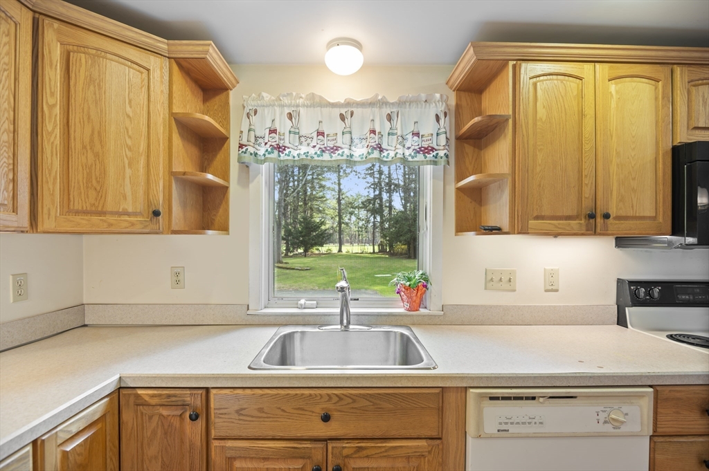 110 Linden Street Hamilton, MA 01982 - Photo 8 of 25 a kitchen with a sink cabinets and a large window