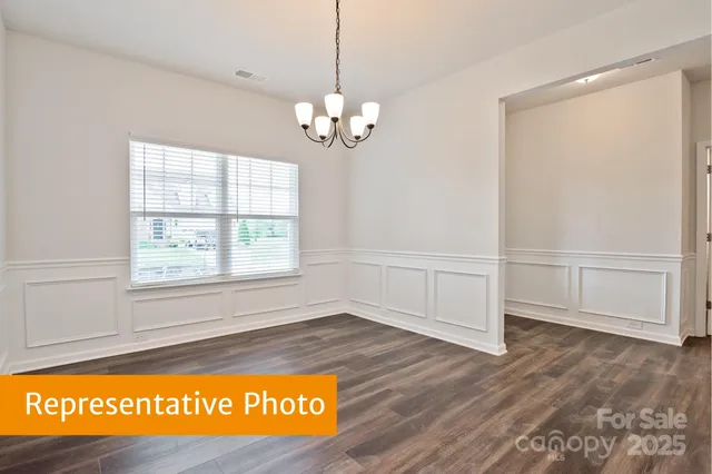 a bathroom with a sink shower and a mirror