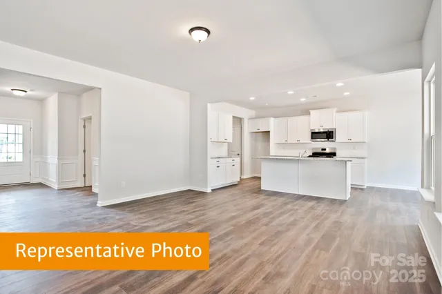 a view of kitchen view with wooden floor and window