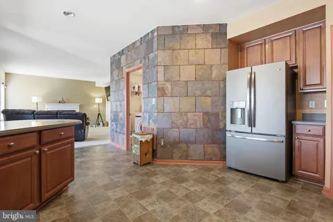 a kitchen with stainless steel appliances a refrigerator and a sink