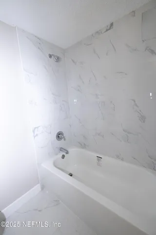 a bathroom with a bathtub