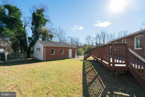a view of wooden deck and a garden
