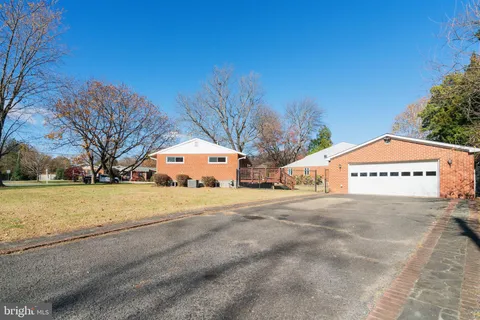 a large building with trees in front of it