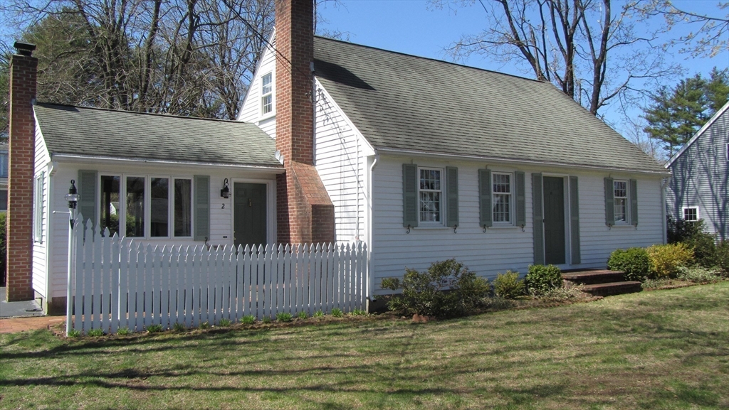 2 Bertha Street Hudson, MA 01749 - Photo 17 of 17 a view of a house with a small yard plants and large tree