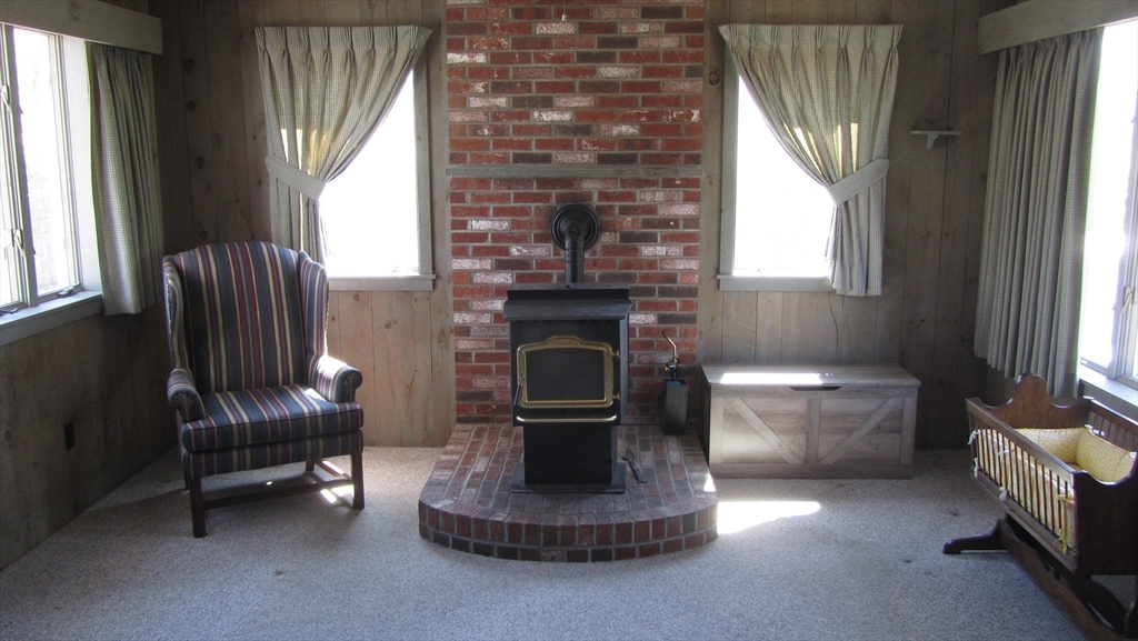 2 Bertha Street Hudson, MA 01749 - Photo 6 of 17 a living room with furniture and a fireplace