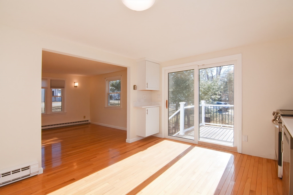 25 Indian Run Road Bellingham, MA 02019 - Photo 14 of 29 an empty room with wooden floor and windows